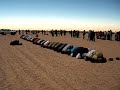 during the eclipse in the south of libya, i was filming a prayer line, and caught an amusing moment as one of the gentlemen praying decides that its time to abandon his prayers and put on some kooky eclipse glasses. no disrepect intended.