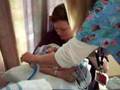Mom Holding Baby Sam While on C-Pap