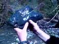 two boys a stream and suiseki stones