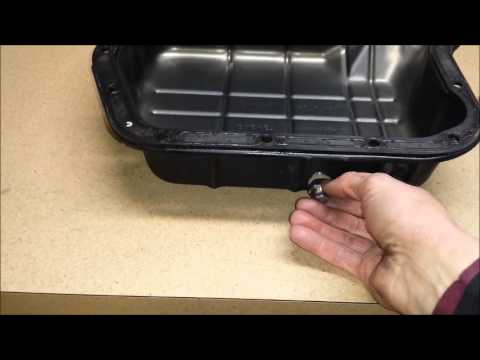 how to drain transmission fluid without dropping the pan