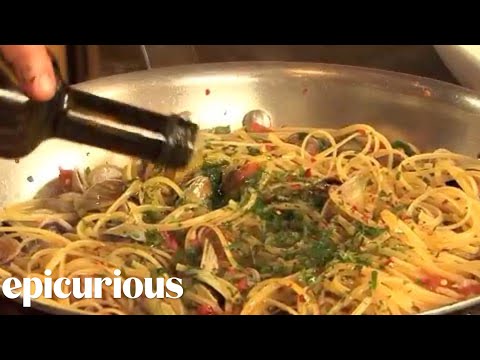epicuriousdotcom - Mario Batali demonstrates his recipe for linguine with clams, a traditional part of the Italian Christmas Eve Feast of the Seven Fishes. Subscribe to the all...