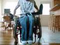 paraplegic walking in braces with walker