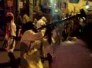 A band of musicians traveling with a pilgramige to Paladi stop outside of the Temple Tower in Mahamunausher.  Video by Michael T. Balonek.