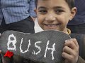 Scores of Shoes Thrown at Bush Caricature