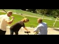girl get hit by a golf ball in the head and fall of the bike