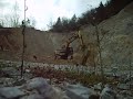 Working on Kobelco SK 200 excavator