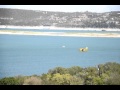 planes getting water at lake travis for TX fires