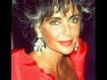 dame elizabeth taylor has taken our breath away on more than one occasion as appearing in public being mesmerizingly beautiful. who can forget her 75th birthday when she was dressed in white and wearing millions of dollars worth of diamond? there was the 1970 academy award ceremonies with her 69 carat diamond places o her chest. she was tanned and wearing a sapphire gown.  she was 38. her first wedding in 1950, she was 18. and then there is the beginning of this clip. this event was her 55th birthday gala in february 1987. her red gown and deep tan was spellbinding. photo appeared in magazines depicting this event for years to come. no matter what color she wears, she becomes and maintains to be a vision of pure beauty. 
         in viewing these short film clips, please donate to the cause that has become dame elizabeth taylor's life mission for over two decades. the eradication of aids in the world. until such time, 