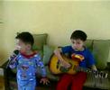 Amiel plays guitar while Guile Sings Amiel plays guitar while Guile Sings