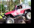 AiRock equipped Jeep climbs obstacle