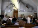 Choristers Sing \"Lamb of God\" at Reunion