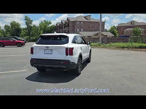 Used 2021 White Pearl KIA S AWD image 1