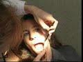Woman getting mouth examined by a dentist