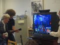 mrs. melanson playing Guitar hero in Class