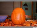 Ghost Carves Halloween Pumpkin