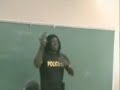A cop is talking to school kids and accidentally shoots himself