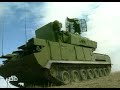 the shilka zsu-23-4 [zsu = zenitnaya samokhodnaya ustanovka - anti-aircraft self-propelled gun] is a self-propelled anti-aircraft gun (spaag) featuring a prominent radar dish that can be folded down mounted on a modified pt-76 chassis. zsu 23-4 shilka, is capable of acquiring, tracking and engaging low-flying aircraft (as well as mobile ground targets while either in place or on the move). employed in pairs 200 meters apart, 400 meters behind battalion leading elements, it is commonly used to surpress atgm launch sites, such as tow vehicles. the armament consists of four 23mm cannon with a maximum slant range of 3,000 meters. ammunition is normally loaded with a ratio of three he rounds to one ap round. resupply vehicles carry an estimated additional 3,000 rounds for each of the four zsus in a typical battery. recent (october 1997) information details zsu-23-4 updates/modernization being offered by the ukrainians that include: a new radar system replacing the gun dish radar, plus a sensor pod believed to include day/night camera, and a laser rangefinder; and mounted above radar/sensor pod is a layer of six fire-and-forget sams, believed to be russian sa-18/grouse.

the zsu-23-4 is a fully integrated, self-propelled antiaircraft system with four liquid-cooled 23-mm automatic cannons mounted on the front of a large, flat, armored turret. the chassis has many components borrowed from other soviet armored vehicles, and the suspension system resembles that of the pt-76 and asu 85 (six road wheels and no track support rollers). the driver sits in the left front of the hull, and the rest of the crew (commander, gunner, and radar operator) are located in the turret. the gun dish fire control radar mounted on the rear of the turret can be folded down during travel.

a number of different zsu-23-4 models have been produced. these are primarily distinguishable externally by the types of stowage boxes on the turret and minor modifications in the mounting of the guns.

capabilities:

a platoon of four zsu-23-4s is assigned, along with four sa-9/gaskin sam systems, to the antiaircraft battery of motorized rifle and tank regiments to cover the deadspace of the sa-6/gainful in the division air defense umbrella. two zsu-23-4s usually will be in support of each of the two first-echelon battalions, each weapon normally separated by 200 meters, typically traveling 400 meters behind the battalion's leading elements.

the zsu-23-4 is not amphibious, but has a fording capability of just over one meter. during river assault operations, the zsu-23-4s would be ferried to the far bank immediately after the leading companies.

the zsu-23-4 has the capability to both acquire and track low-flying aircraft targets, with an effective aa range of 2,500 meters. it also is capable of firing on the move because of its integrated radar/gun stabilization system. the high frequency operation of the gun dish radar emits a very narrow beam that provides for excellent aircraft tracking while being difficult to detect or evade. however, such a frequency also dictates a limited range, which can be compensated for by linking the system to other long-range acquisition radar in the area. the zsu-23-4 also can be used against lightly armored ground vehicles.

the four guns are water cooled and have a cyclic rate of fire of 800 to 1,000 rounds per minute each. however, the guns are normally fired in bursts (2-3 rounds per barrel) to reduce ammunition expenditure and prolong barrel life. each zsu-23-4 carries about 2,000 rounds onboard. supply trucks, which follow the zsus at a distance of 1.5 to 2.5 km, carry an estimated additional 3,000 rounds for each of the four zsus. electronic target acquisition, tracking, and ranging are automated, and an onboard computer determines superelevation and azimuth lead. conventional optical sights also are available. two types of ammunition normally are mixed at a ratio of three frag-he-t rounds per one api-t round. an hei-t round also may be fired.

thezsu-23-4can be airlifted bythean-22 or ii-76. the crew of the zsu-23-4 is afforded a degree of protection by the thin armor (maximum thickness 9.4 mm in the hull, 8.9 in the turret). collective nbc protection is provided by a radiation detection and warning system and an air filtration and overpressure system.

limitations:

heavy machine gun fire can penetrate the hull and turret. tread and road wheels are vulnerable to artillery fire. he fragmentation can penetrate the armor, destroy the radar dish, or rupture the liquid coolant sleeves of the 23-mm cannons. the system also is vulnerable to ecm.