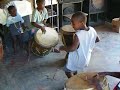 These kids are the children of the guy without the shirt. They are all in a traditional group of Garifuna musicians and dancers from Triunfo de la Cruz, Honduras. The guy with the dreads is Mito, a famous drummer and dancer.
