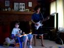 Max playing ThunderStruck