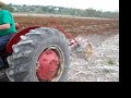 Tractors Plowing Field
