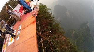 Wingsuit Red Bull Event,base Jumps Off The Dragon Wall And Jeb Flies Through The Hole