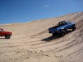Monster truck racing a chevy blazer, watch the sand fly!