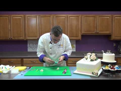 multiple heels and shoes - http://globalsugarart.com In this video Chef Alan Tetreault, of Global Sugar Art, teaches how to cut and assemble high-heeled shoes using JEM's shoe cutter s...