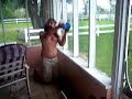 here, i am attempting to bail all of the water off of my porch during a hurricane.