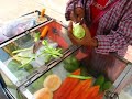 Thai street vendor peeling mango fruit Thai street vendor peeling mango fruit
