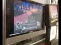 Charles playing guitar hero III and losing