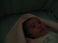Savannah playing in her crib