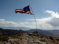Raising the flag on the Tintic Mountains High Point Raising the flag on the Tintic Mountains High Point