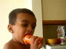 Akhat eating candy