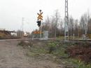 Finnish Express Train 705 going over crossing in Soinlahti