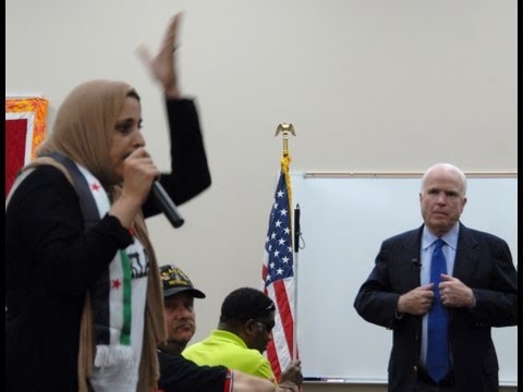mccain - A crowd of 150 hollered and shook fingers in each other's faces, as Sen. John McCain made the case for intervening in Syria during a town hall meeting in Tuc...