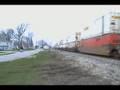 BNSF 5842 West. Note 3 passenger cars on rear!