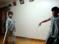 little kids sword fighting.