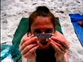A girl who fells like the fatest one on the beach, makes a wish while chewing on some gum.