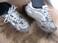 Muddy Saucony Trainers on the carpet #2