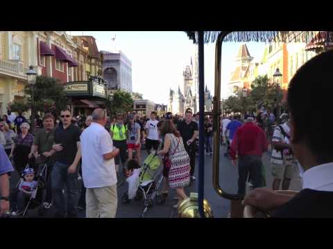 Main Street USA - Come with us as we hitch a ride on the Main Street Transportation Company's horseless carriage. We're riding from Town Square, down a busy Main Street USA, t...