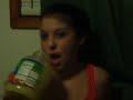 Cazy girl chugging apple sauce while singing yous a hoe