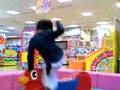 Andrae playing on a game center in Akatsuka