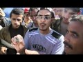 Yemeni protester holds up  shell fired by government forces 