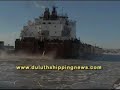 watch the barker come in the duluth piers, moving the ice away as she goes