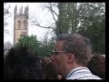 the magadalen college boys choir singing their traditional madrigals (or whatever) at the top the college tower, seen from the other side of magdalen bridge, shortly after sunrise  on 1 may 2005 in oxford.