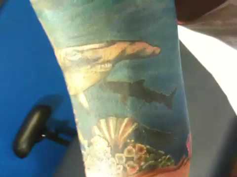 Jeff Covell of Twisted Image Tattoos doing a name coverup tattoo on an ankle using 