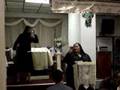 Cece singing Cubreme while Lisandra does the pantomime