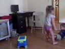 The kids take turns jumping off the stools