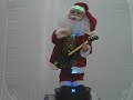 Santa dances & plays guita
