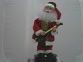 Santa dances  plays guita